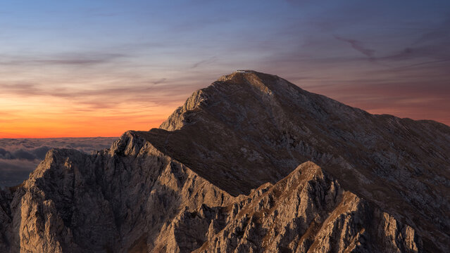Grigna and its refuge on top of the mountain, at sunset