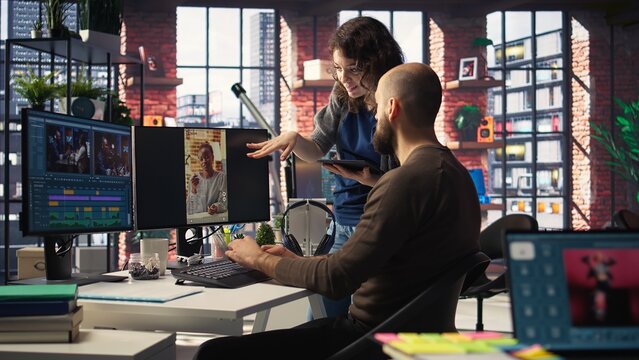 Man and woman collaborate on content creation for the media industry, analyzing data and insights, editing video footage and adjusting branding elements. AI powered. Camera A.