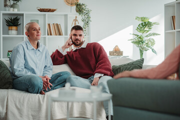 Young couple receiving relationship counseling at therapy session