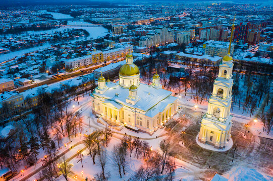 Scenic aerial view of snow covered cityscape of Penza overlooking restored architectural complex of Spassky Cathedral in winter evening, Russia.