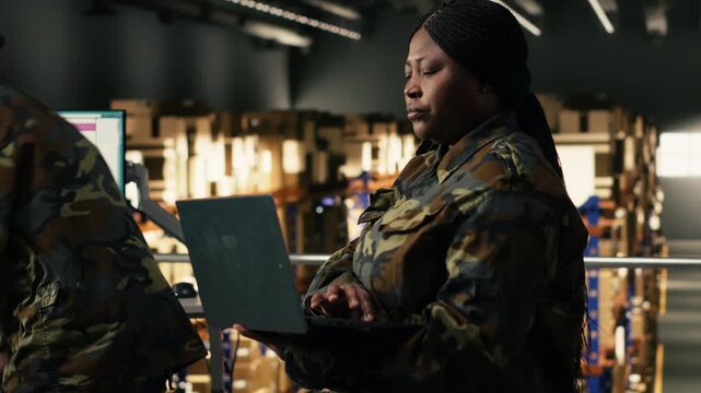 Woman military officer handling defense mission logistics for safety operations, cargo transportation and shipment tracking. Black soldier in uniform manages supply chain process.