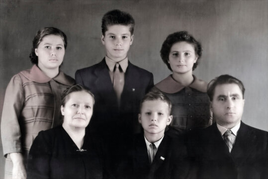 USSR, Leningrad - September 15, 1946: Vintage family portrait. Mother, father, and children. Retro photograph from 1946.