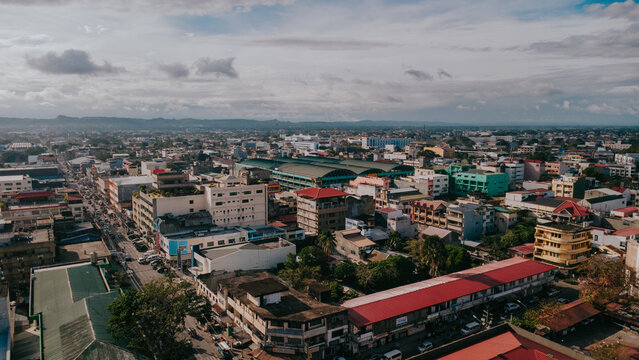 Aerial Cityscape of Tuguegarao City Cagayan Valley, Urban Skyline with Rooftops and Mountains at Horizon, Philippines