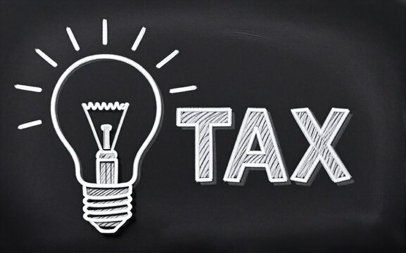 Chalkboard shows light bulb and "TAX" symbolizing ideas about