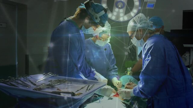 Surgical team starting incision to stop bleeding, passing tools while blue overlay tracing tissue