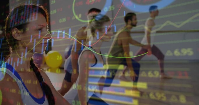 Lead woman and class on cue, performing lunge then arms-up with finance charts overlaying class