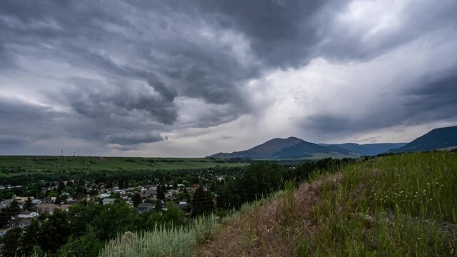 Storm clouds rolling over Red Lodge and the mountains until rain hits the lens, Montana, time lapse