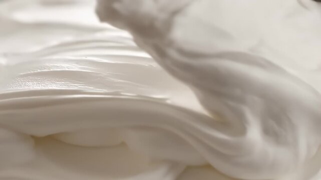 Close Up of Thick White Cream Texture Swirls Smooth Surface Culinary Ingredient Dessert Topping Baking Ingredient