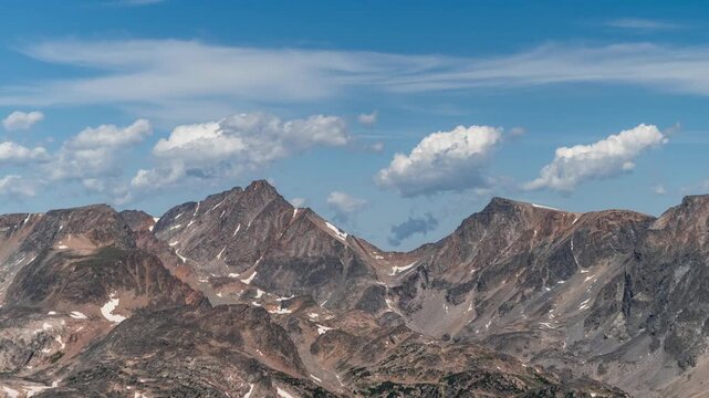 Puffy clouds forming over the jagged peaks around Granite Peak, the highest point in Montana, time lapse