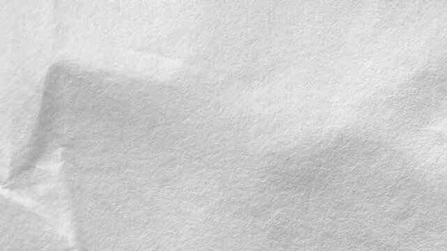Gray crumpled paper texture background for business and creative design projects. High-quality minimalist wrinkled paper surface animation.