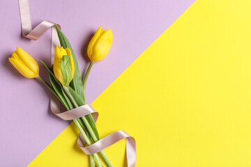 Naklejka premium Beautiful bouquet of tulip flowers on color background