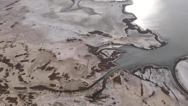 Footage of shallow lakes and deltas formed on the seashore, where rivers flow into the sea, called lagoons.