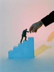 Hand Guiding Small Figure Climbing Steps for Mentorship and Career Growth Concept, Leadership Coaching and Support in Business Setting with Copy Space