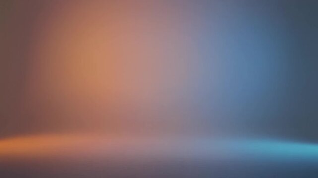 Ethereal abstract background showcasing a mesmerizing gradient of warm orange and cool blue light, creating a tranquil yet dynamic glow reminiscent of a subtle, enchanting firefly display