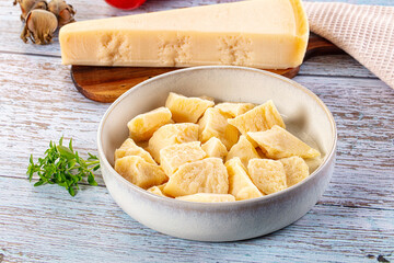 Parmesan cheese pieces in the bowl
