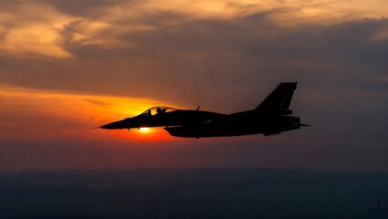 Silhouette of fighter jet flying at sunset with vibrant orange sky