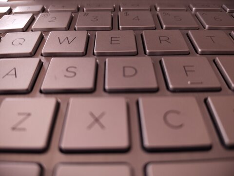Close up view of the QWERTY section of a laptop keyboard