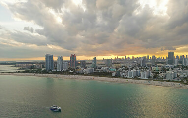 Fototapeta premium Miami pier with south pointe at night. Miami beach waterfront at dusk. Miami city at evening. Miami shoreline.