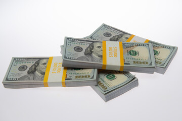 Money in USA dollar banknotes in stacks. Money in dollar stack in studio. Money in dollar bill bundles. Money in dollar bills on paper concept.