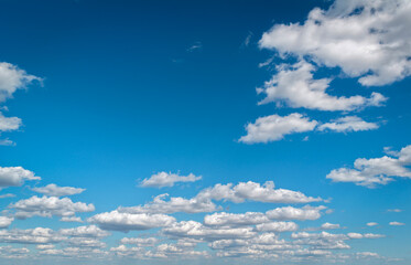Clouds drifting. Airy sunny scene. Soft natural sky background. Blue sky with white clouds. Pure sky and soft clouds.