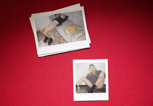 Real photo of wide and square Instant Photos on red. PSD template mockup.