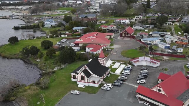 Drone view of Ohinemutu, a Māori cultural village with church and community buildings in Rotorua, New Zealand