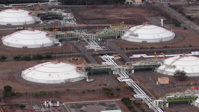 Aerial view of lng terminal industrial storage tanks