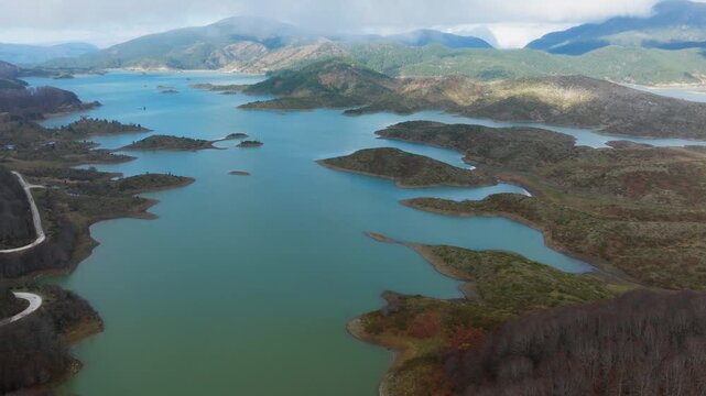 Islands and peninsulas at Aoos Springs Lake Techniti Limni Aoou Epirus Greece, establishing panoramic aerial overview