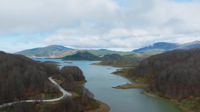 Aoos Springs Lake Techniti Limni Aoou in Epirus Greece, establishing aerial panoramic pullback of landscape
