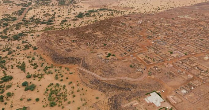 Panoramic View Of Ancient Desert Town Of Ouadane In The Adrar Region Of Mauritania. Aerial Drone Shot