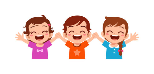 Three happy children smiling widely laughing with hands raised holding hands together