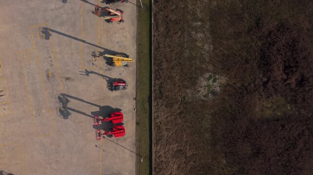 Construction Equipment Yard With Lifts And Loaders Aerial View