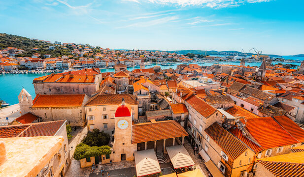 panoramic view over the historic red roofs of Trogir old town and the Adriatic sea from the bell tower of St. Lawrence Cathedral, Croatia.