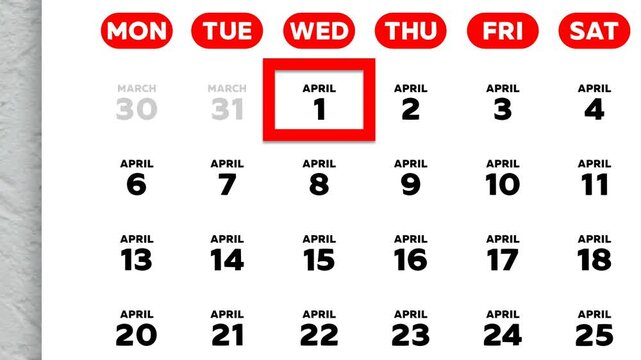 The date April 1st marked with a red cursor on the wall calendar 2026