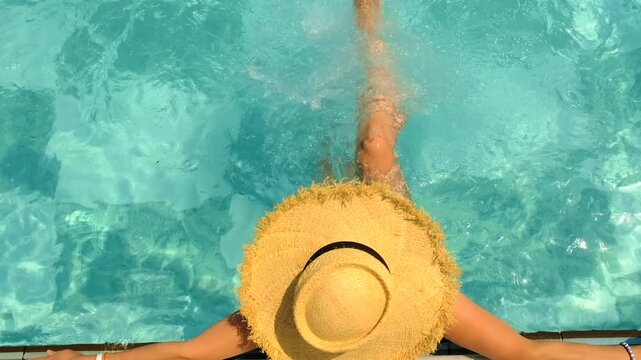Woman in hat in swimming pool. selective focus.