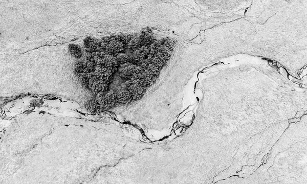 Rivers and streams run through desolate icelandic winter landscape