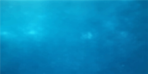 A deep blue ocean surface ripples with natural wave patterns as sunlight pierces the water texture to create a serene nature backdrop and artistic wallpaper design