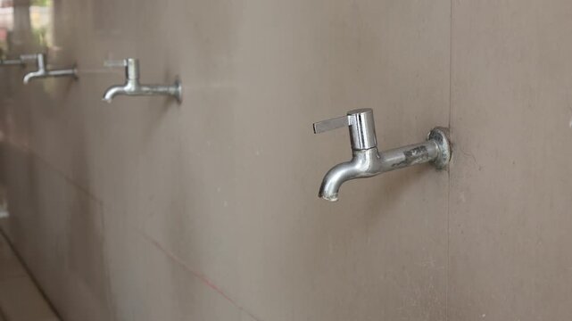 ablution place and the fountain flowing taps, the fountain ablution place. ablution place for Muslims, fountain. 4k video

