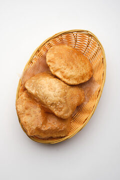 Freshly made bread rounds in a basket ready for serving in a dining setting during lunchtime