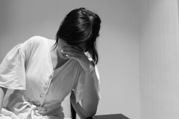 Fototapeta premium Unhappy asian woman girl disappointed, sad about problem in home alone, feel lonely, Stressed, suffering from bad relationship, break up, divorce, female confused, depression mental health, loneliness