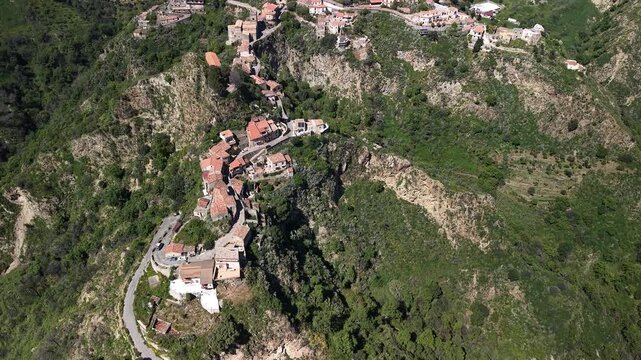 Aerial view of Pentefur Castle and lush landscapes in Savoca, Sicily