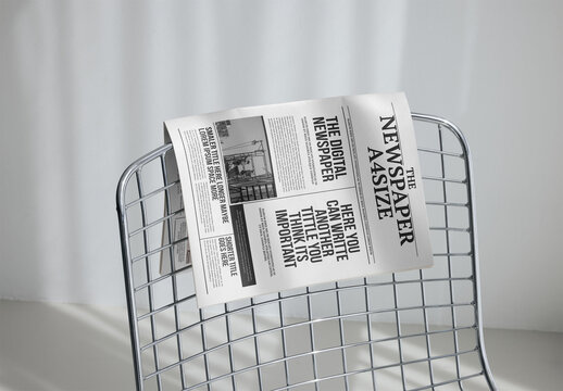 Mockup Of Customizable A4 Newspaper On Chair