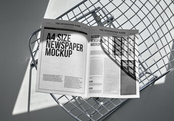 Mockup Of Customizable Open A4 Newspaper On Chair