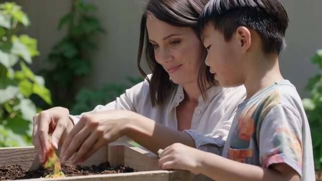 Woman teaching a young child how to compost food scraps in a garden, promoting eco-friendly habits