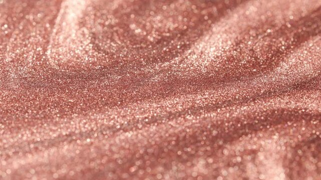 Spinning close-up of radiant rose gold paint with specialized sandy texture and glitter particles sweeping across the surface