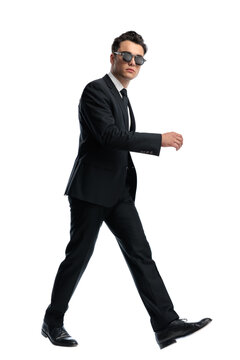 Side view of stlyish man with sunglasses walking