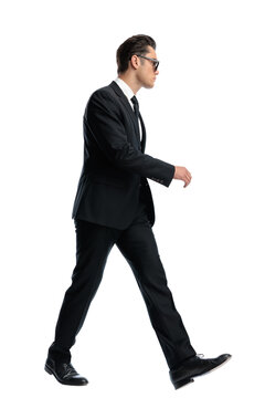 Side view of determined man walking