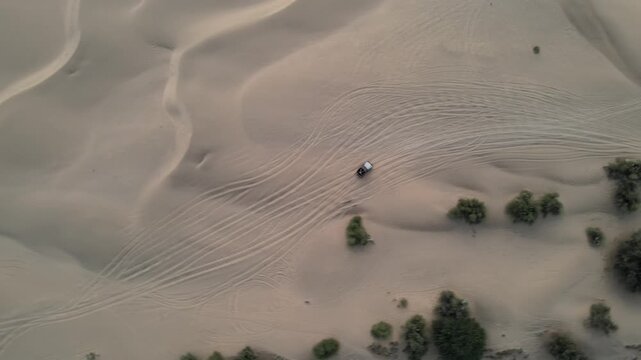 Aerial View of Tourists Enjoying Jeep Safari in Sand Dunes Jaisalmer Thar Desert India