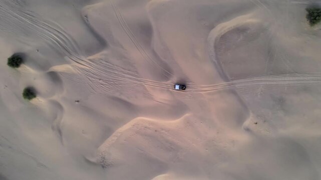 Aerial View of Tourists Enjoying Jeep Safari in Sand Dunes Jaisalmer Thar Desert India