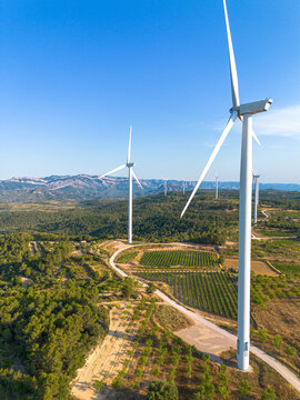 Wind turbines aerial view over Terra Alta Catalonia Spain hills showing renewable energy sustainability and large scale clean electricity
